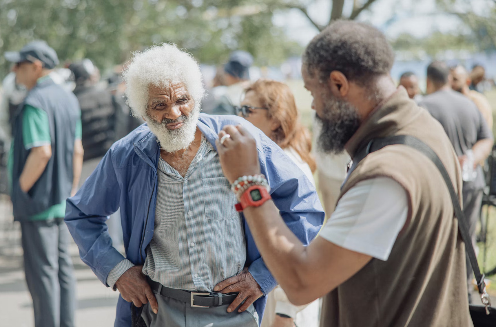 two adults, older, younger, conversation